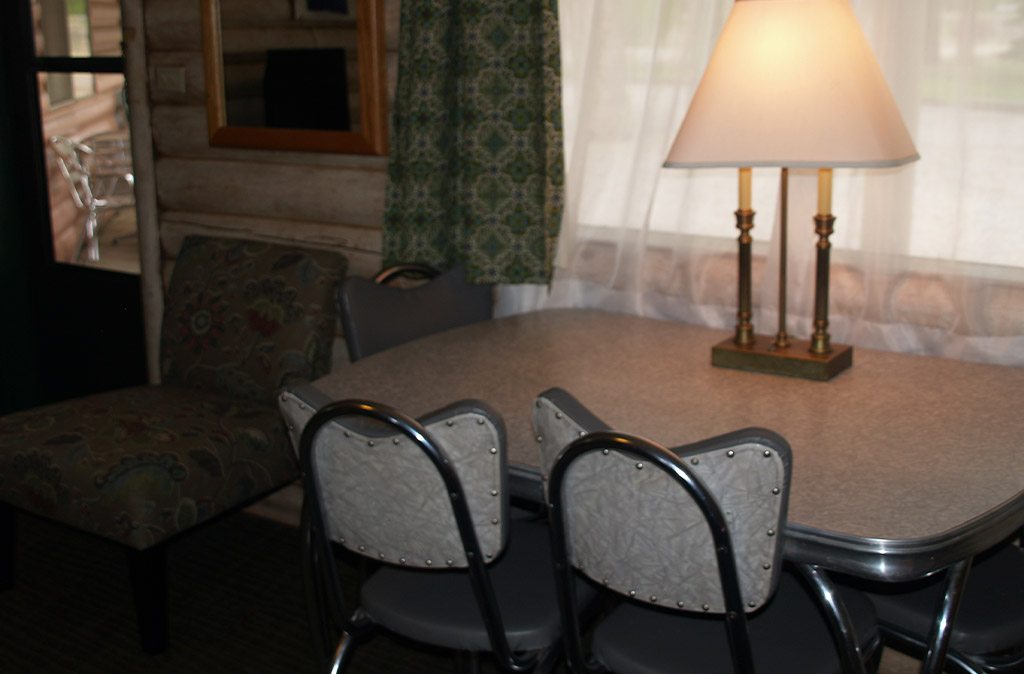 Photo of Queen Studio Unit at Island Acres Resort Motel showing mid-century dining table.