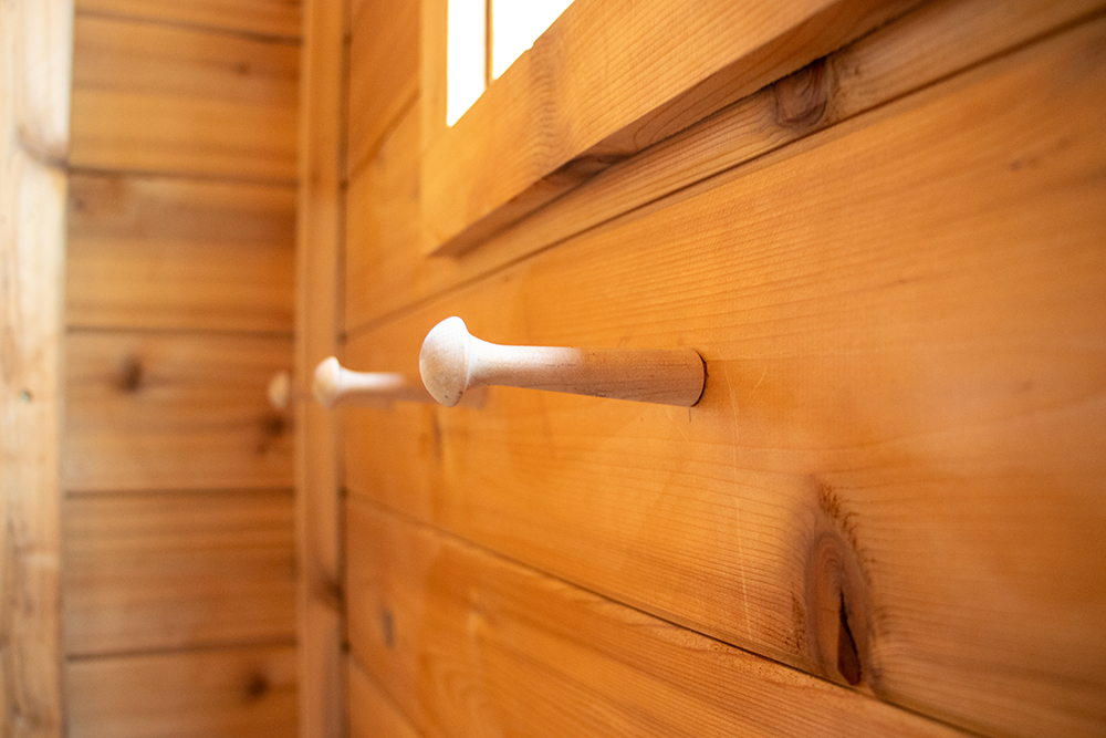 Enhance Your Gunnison Stay with a Nordic Sauna Experience Photo of towel hooks in Norra Dalen Nordic Sauna at Island Acres Resort Motel in Gunnison, Colorado