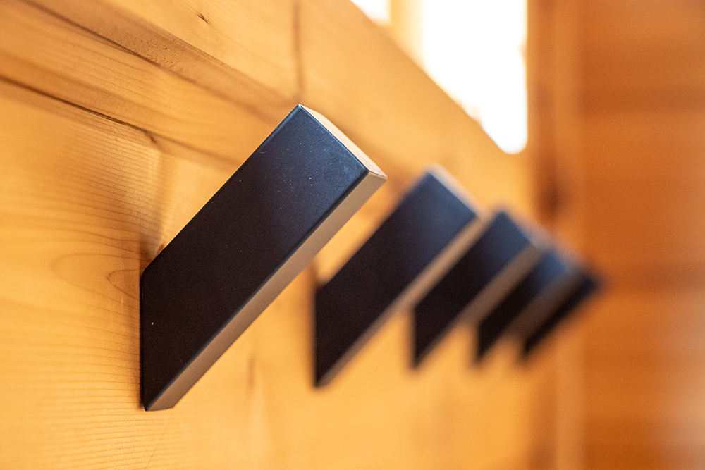 Enhance Your Gunnison Stay with a Nordic Sauna Experience Photo of towel hooks in Norra Dalen Nordic Sauna at Island Acres Resort Motel in Gunnison, Colorado